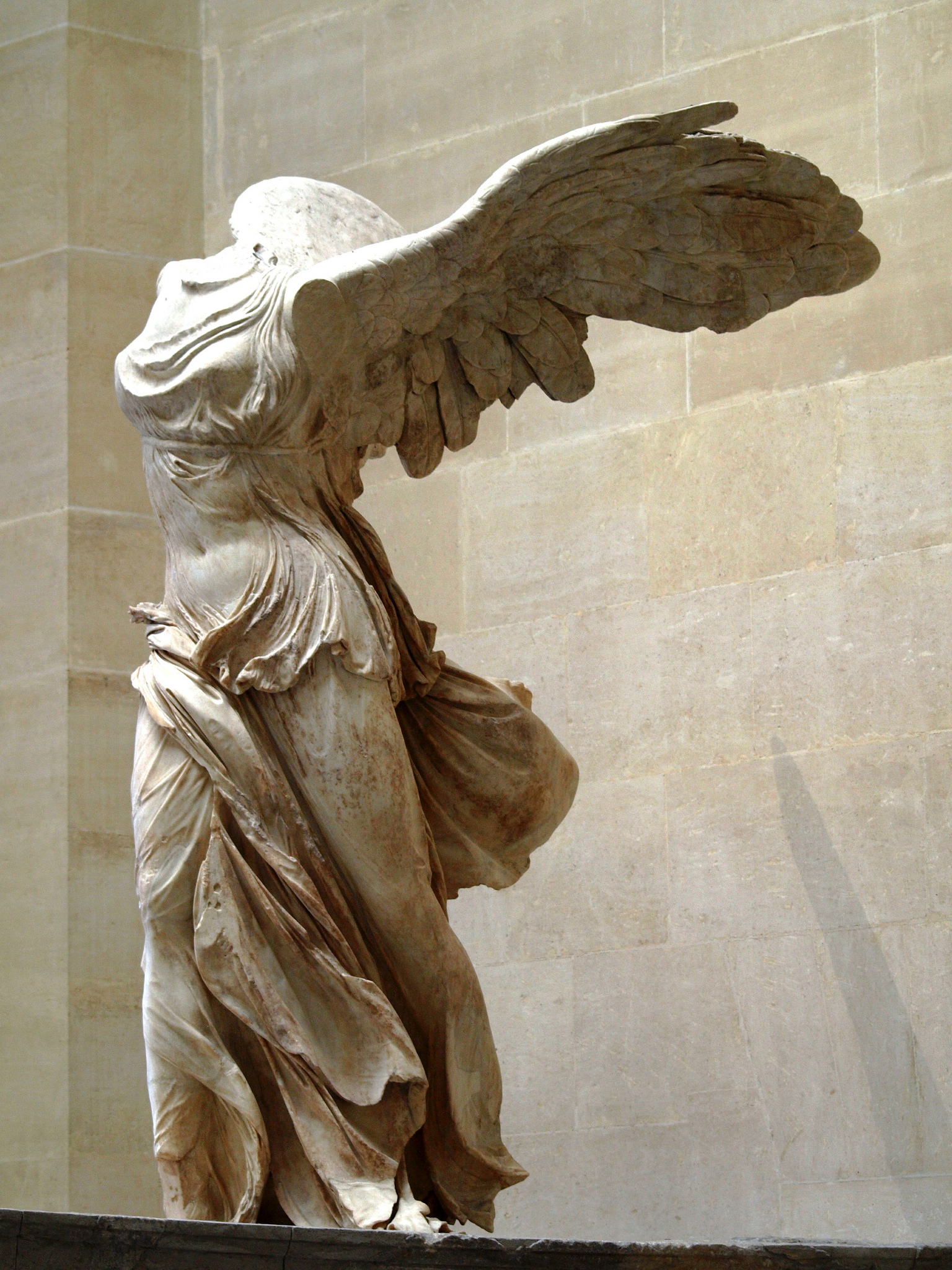 Who created the winged victory statue and when? Find out the artist and the story behind it.